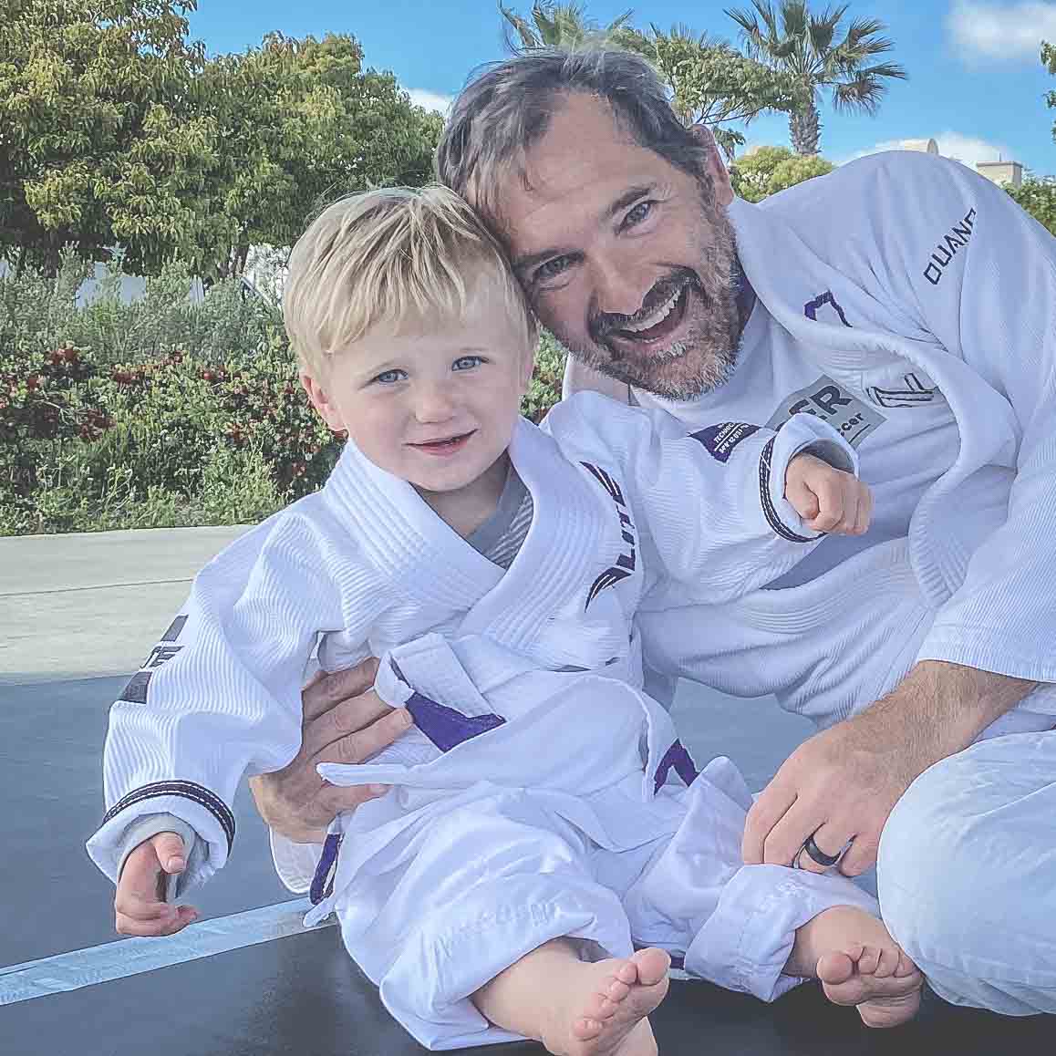 Professor Wally training with a young student on the mats
